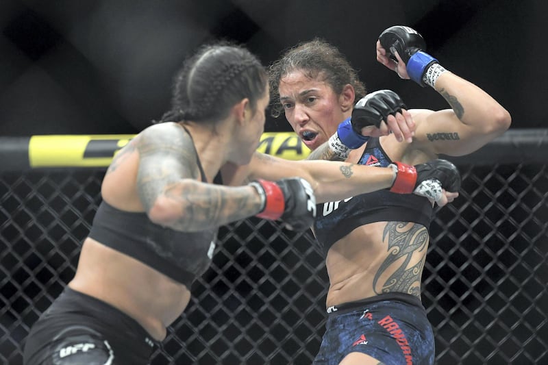 Dec 14, 2019; Las Vegas, NV, USA; Amanda Nunes (red gloves) fights Germaine de Randamie (blue gloves) during UFC 245 at T-Mobile Arena. Mandatory Credit: Stephen R. Sylvanie-USA TODAY Sports