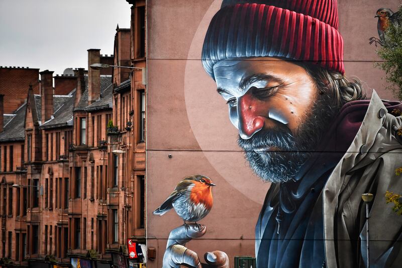 A mural near Glasgow cathedral in 2016. Murals have been appearing across the city since 2008. Getty Images