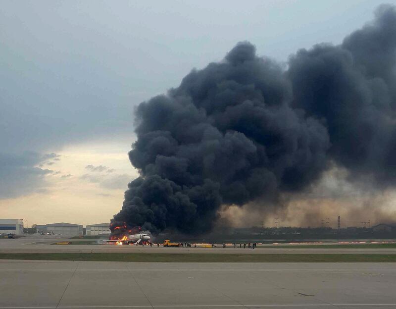 The plane is seen on fire after an emergency landing at the Sheremetyevo Airport outside Moscow. Reuters