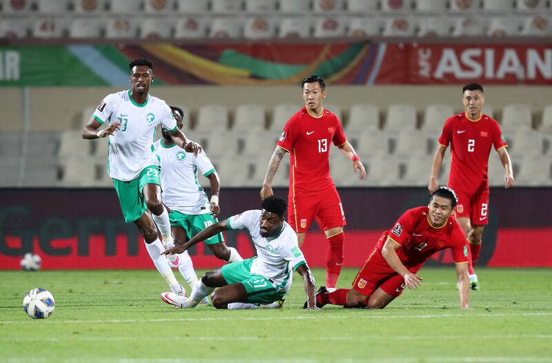 Saudi Arabia and China in action during the World Cup qualifier at Sharjah Stadium.