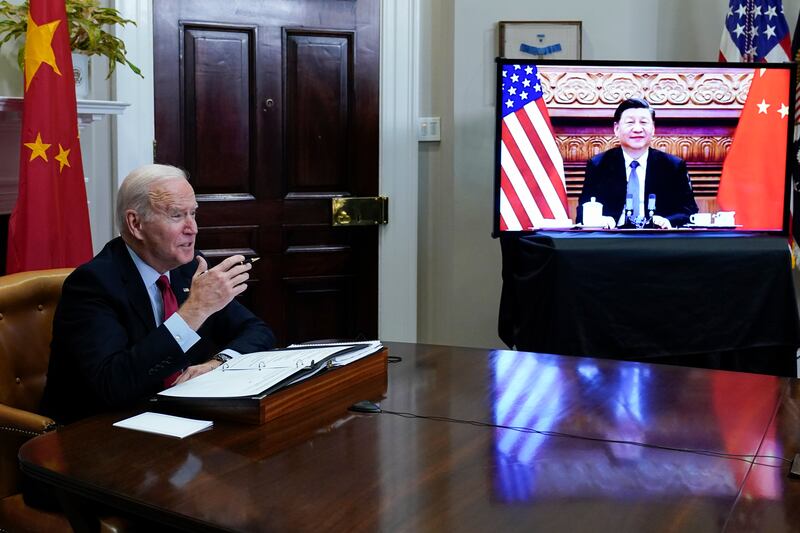 US President Joe Biden meets virtually with Chinese President Xi Jinping from the Roosevelt Room of the White House in Washington on Monday. AP Photo