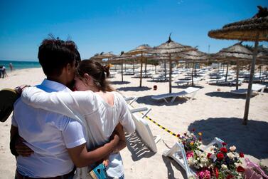 (FILES) In this file photo taken on June 27, 2015, people react at the site of a shooting attack on the beach in front of the Riu Imperial Marhaba Hotel in Port el Kantaoui, on the outskirts of Sousse south of the capital Tunis. A Tunisian court was poised to give verdicts on February 8, 2019, in the trials of suspects in deadly jihadist attacks on the Tunsian capital's Bardo museum and on a beach in the tourist resort of Sousse, lawyers told AFP. On June 26, 2015 a shooting rampage in Sousse killed 38 people, most of them British tourists. / AFP / Kenzo TRIBOUILLARD