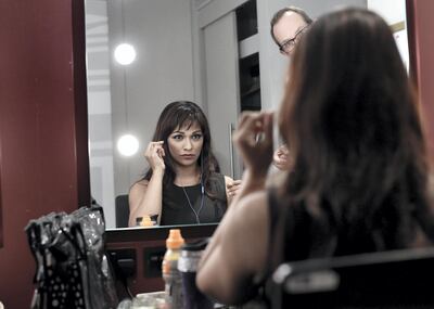 LONDON, ENGLAND - SEPTEMBER 12:  (EDITORS NOTE: Image has been digitally altered) Soprano Danielle De Niese warms up backstage at The Royal Albert Hall as she prepares to perform at Last Night of The Proms on September 12, 2015 in London, England. World Famous Soprano Danielle De Niese is married to Glyndebourne's Gus Christie and they have a 3 month old son, Bacchus.  (Photo by Gareth Cattermole/Getty Images)