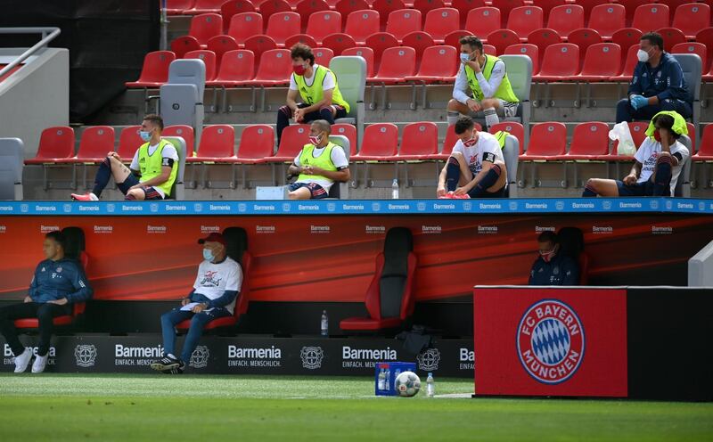Bayern Munich substitutes sit in the stand during the Bundesliga match between Bayer Leverkusen and Bayern Munich at BayArena. EPA