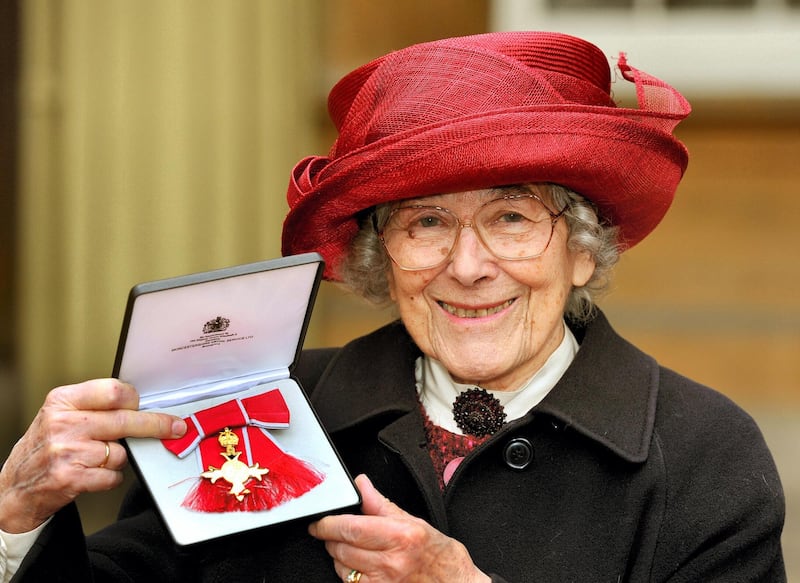 German-born British author Judith Kerr poses for a picture with her Order of the British Empire (OBE) medal after it was presented to her by the Prince of Wales during the Investiture ceremony at Buckingham Palace in central London on January 25, 2013. AFP PHOTO/POOL/JOHN STILLWELL (Photo by JOHN STILLWELL / POOL / AFP)