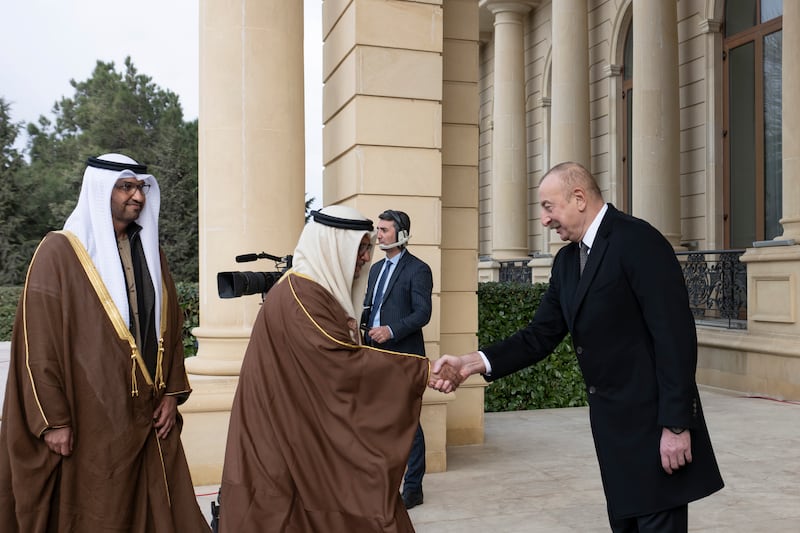 Mr Aliyev greets Dr Anwar Gargash, diplomatic adviser to the UAE President