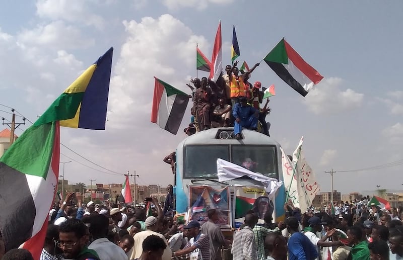 Sudanese people from other provinces arrive by train to join the popular celebrations about the power sharing agreement between the opposition and the military council, in Khartoum, Sudan.  EPA