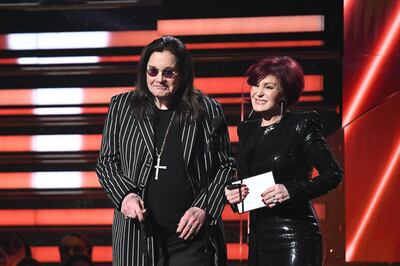 British singer Ozzy Osbourne (L) and wife British television personality Sharon Osbourne present the award for Best Rap/Sung Performance during the 62nd Annual Grammy Awards on January 26, 2020, in Los Angeles. (Photo by Robyn Beck / AFP)