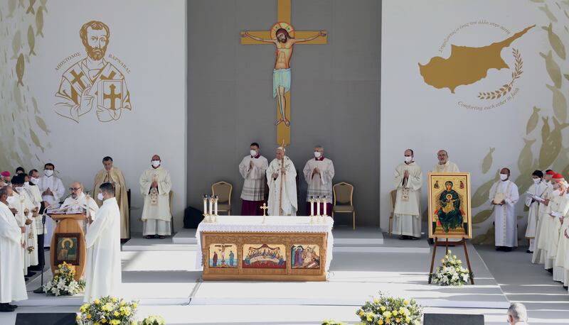 Pope Francis leads a Holy Mass at the GSP Stadium in Nicosia, Cyprus, as worshippers, many of whom are overseas workers, look on.   EPA / KATIA CHRISTODOULOU