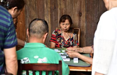 Anren residents play a game of mahjong. Ronan O'Connell for The National