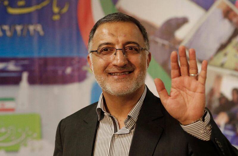 Iranian conservative presidential candidate, Alireza Zakani, waves after registering his candidacy for the upcoming presidential elections at the ministry of interior in the capital Tehran on April 14, 2017. (Photo by ATTA KENARE / AFP)