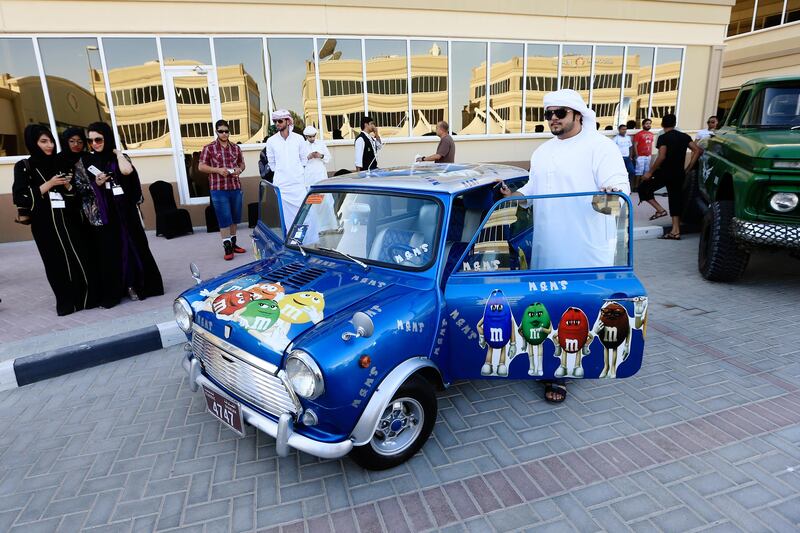 Dubai, May 31, 2013 - Abdul Razzaq Al Zarooni stands with his 1975 Mini Cooper with M&M custom detailing at the Fast and Furious "Extreme Car Park" event at Studio City in Dubai, May 31, 2013. (Photo by: Sarah Dea/The National)

