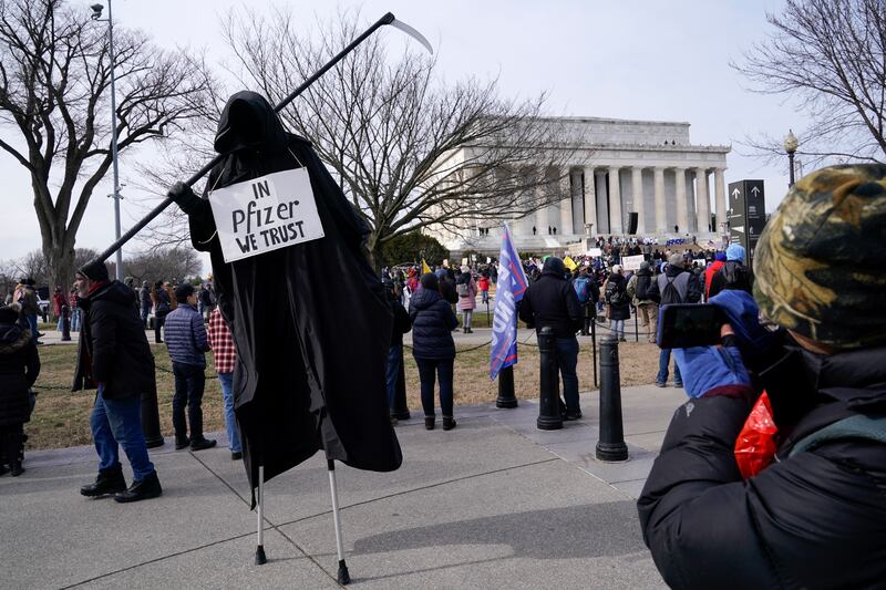 A protester dressed as the Grim Reaper participates in an anti-vaccine rally in front of the Lincoln Memorial in Washington, US. AP