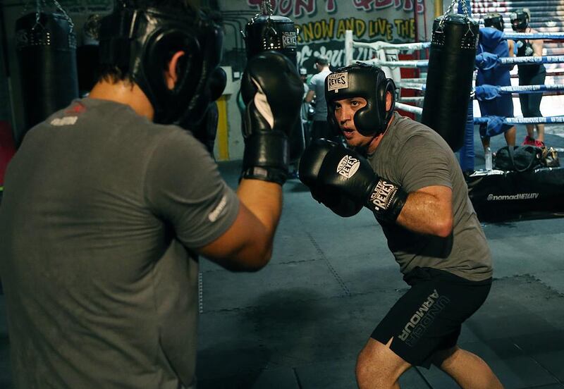 Yussef Hawatt, right, one of the contestants on Nomad Productions’s new reality-TV show Fighting Fit Dubai, trains at the Warehouse Gym in Dubai. Satish Kumar / The National 