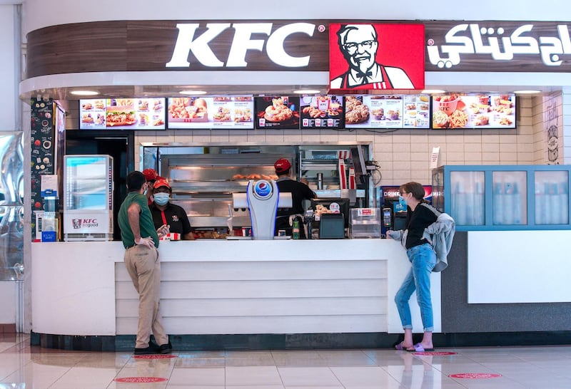 Abu Dhabi, United Arab Emirates, May 24, 2020.     Food court visitors practice social distancing at KFC, Mushrif Mall while getting a bite to eat.Victor Besa  / The NationalSection:  Standalone / Stock