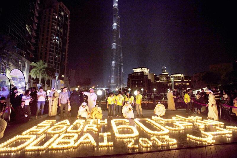 Participants gather at the Earth Hour Walk event at the Burj Plaza in Downtown Dubai last year. Jaime Puebla / The National