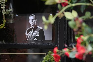 A picture of Britain's Prince Philip, Duke of Edinburgh is placed in window of a pub near Windsor Castle following his passing, in Windsor. EPA