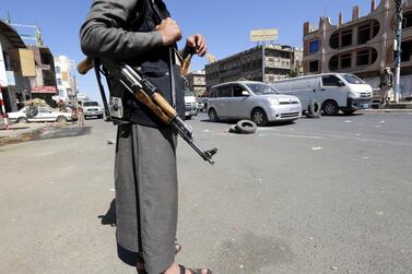 Houthi fighters man a checkpoint in the Yemeni capital Sanaa. Mohammed Al Kairaee was a member of the rebels' Supreme Revolutionary Committee. EPA