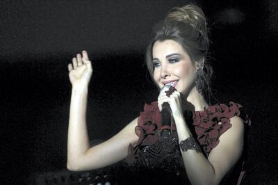 Lebanese singer Nancy Ajram performs during the 53rd session of the international Festival of Carthage at the Roman Theatre of Carthage in Tunis on August 9, 2017. (Photo by STRINGER / AFP)