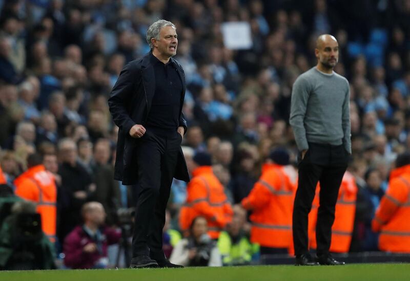 Soccer Football - Premier League - Manchester City vs Manchester United - Etihad Stadium, Manchester, Britain - April 7, 2018   Manchester City manager Pep Guardiola and Manchester United manager Jose Mourinho                           REUTERS/Russell Cheyne    EDITORIAL USE ONLY. No use with unauthorized audio, video, data, fixture lists, club/league logos or "live" services. Online in-match use limited to 75 images, no video emulation. No use in betting, games or single club/league/player publications.  Please contact your account representative for further details.