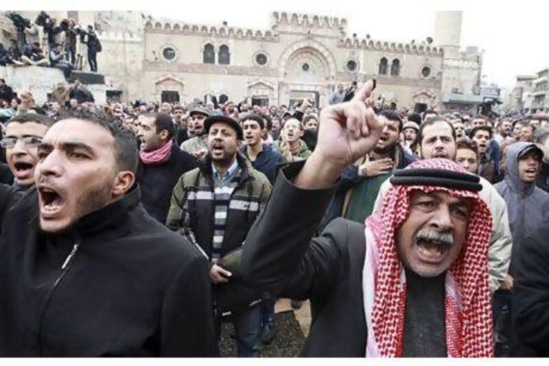 Jordanians protest against rising fuel prices in Amman on Friday.