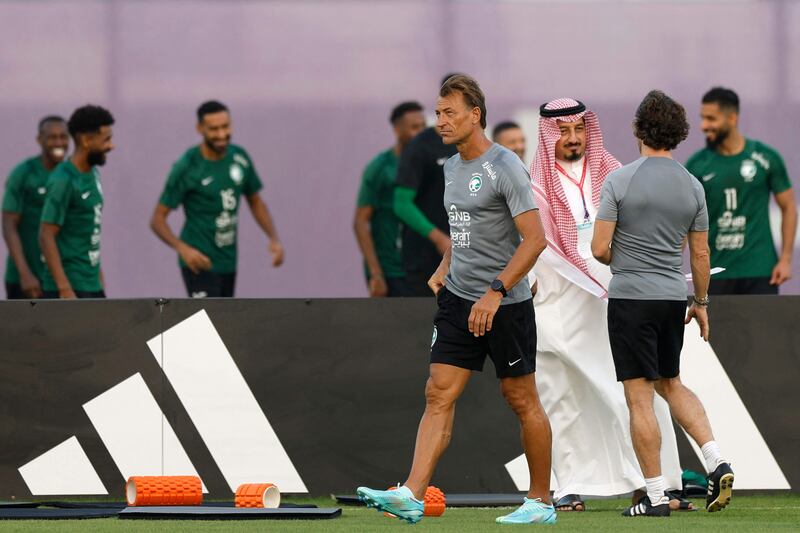 Herve Renard and the President of the Saudi Arabian Football Federation Yasser al-Misehal attend a training session. AFP
