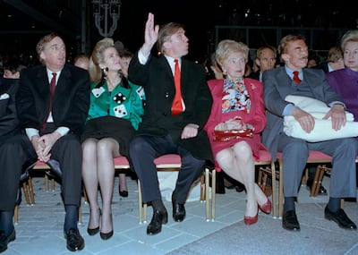 FILE - In this April 5, 1990, file photo, Donald Trump waves to staff members of the Trump Taj Mahal Casino Resort as they cheer him on before the grand opening ceremonies in Atlantic City, N.J. Trump attended the gala with his mother, Mary; father, Fred; and sister, U.S. District Court Judge Maryanne Trump Barry, right. On the left are Donald Trump's brother Robert Trump and his wife, Blaine Trump. Robert Trump, a businessman known for an even keel that seemed almost incompatible with the family name, died Saturday night, Aug. 15, 2020, after being hospitalized in New York, the president said in a statement. He was 71. The president visited his brother at a New York City hospital on Friday after White House officials said Robert Trump had become seriously ill. (AP Photo/Charles Rex Arbogast, File)