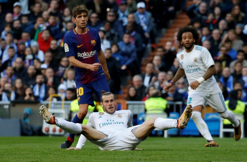 Soccer Football - La Liga Santander - Real Madrid vs FC Barcelona - Santiago Bernabeu, Madrid, Spain - December 23, 2017 Real Madrid’s Gareth Bale after falling to the ground REUTERS/Stringer
