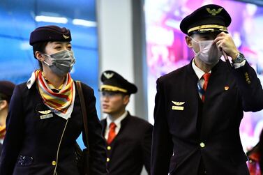 Flight crew wearing masks to protect themselves from coronavirus arrive from China at Vancouver International Airports. Reuters