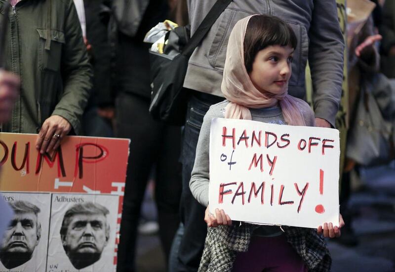 Rosalie Gurna, 9, joins hundreds of protesters denouncing the US ban on travellers from Muslim-majority countries outside Los Angeles International Airport on January 28, 2017. Eugene Garcia / EPA