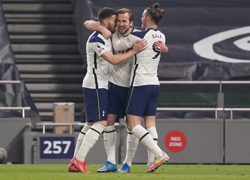 Harry Kane celebrates with Gareth Bale and Matt Doherty after the third. EPA