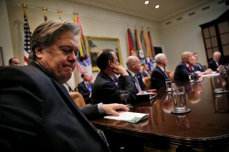 FILE PHOTO:  White House Chief Strategist Stephen Bannon (L) attends a meeting between U.S. President Donald Trump and congressional leaders to discuss trade deals at the at the Roosevelt room of the White House in Washington U.S., February 2, 2017. REUTERS/Carlos Barria/File Photo