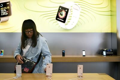 A customer looks at an Apple Inc. iPhone 8 Plus at the Apple Store at Sanlitun during the launch of the device in Beijing, China, on Friday, Sept. 22, 2017. Consumers pre-ordered about 1.5 million iPhone 8 handsets on Chinese retail website JD.com in the first three days, compared with about 3.5 million for the comparable period of iPhone 7 orders, according to Rosenblatt Securities analyst Jun Zhang. Photographer: Giulia Marchi/Bloomberg