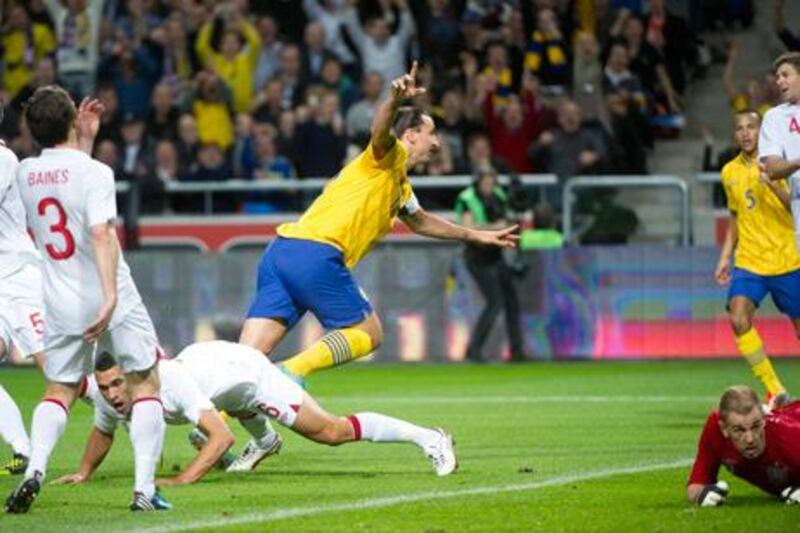 Sweden captain Zlatan Ibrahimovic scores against England during their friendly.
