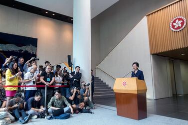 Carrie Lam, Hong Kong's chief executive, right, speaks during a news conference in Hong Kong, China. She pledged to "right away" establish a platform for dialogue with the government’s critics after more than two months of protests. Bloomberg