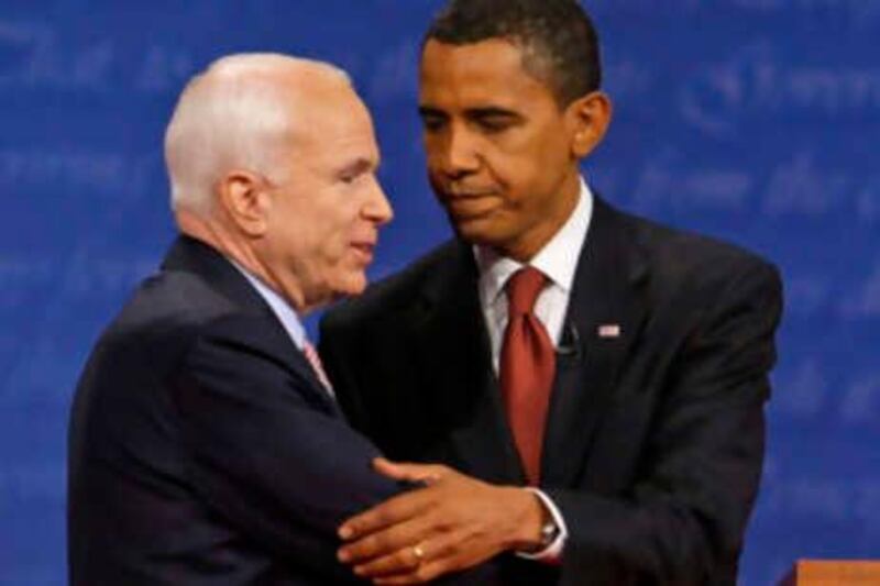 John McCain, left, and Barack Obama embrace at the finish of  a presidential debate at the University of Mississippi in Oxford, Miss., Friday, Sept. 26, 2008.  (AP Photo/Charles Dharapak) *** Local Caption ***  MSTS135_Presidential_Debate.jpg