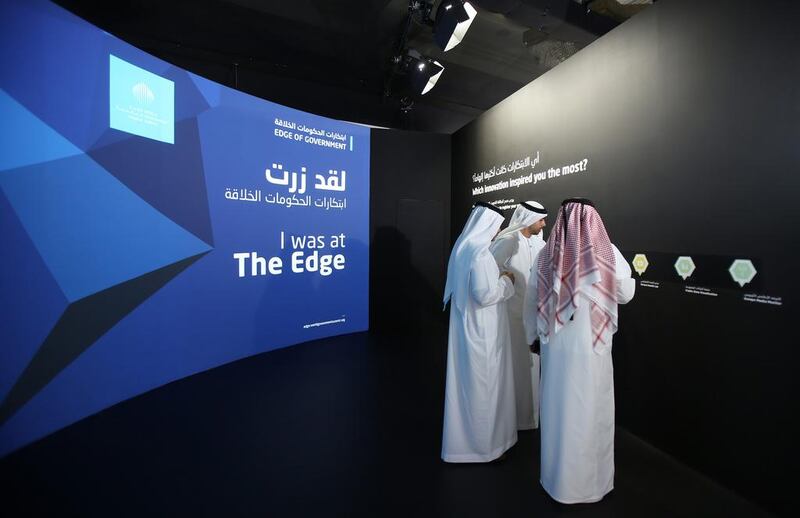 Emirati officials visit an exhibition during the opening day of the World Government Summit in Dubai. Kamran Jebreili / AP Photo