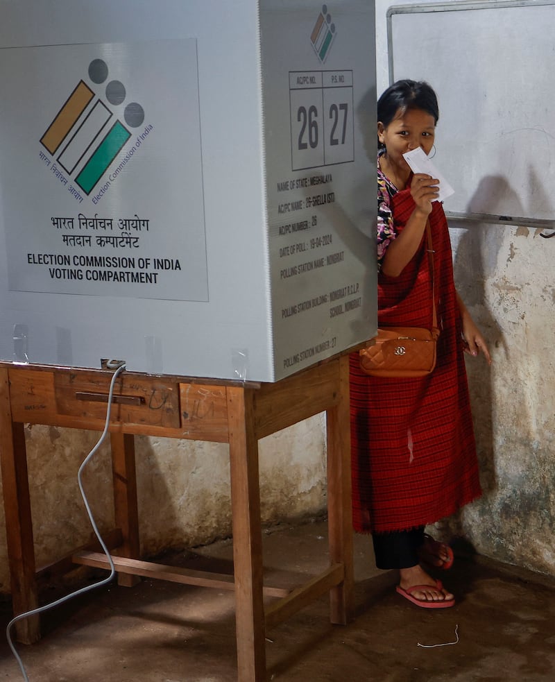 A woman leaves a polling booth after voting in Nongriat village, Meghalaya state. Reuters