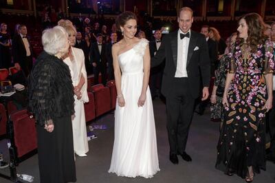 Britain's Prince William and Kate, Duchess of Cambridge with Thelma Schoonmaker, left, Joanna Lumley, 2nd left, and Amanda Berry CEO of BAFTA, right after the BAFTA 2019 Awards at The Royal Albert Hall in London, Sunday Feb. 10, 2019. (AP Photo/Tim Ireland, Pool)