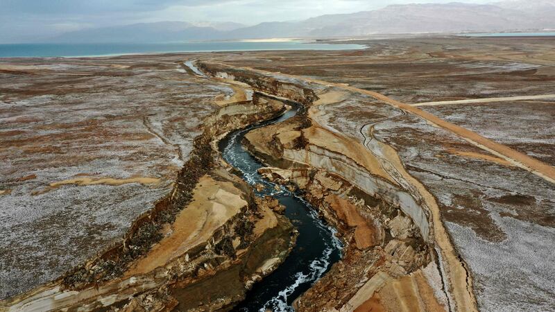 The Araba river crosses a salt pan and area of dried-up sea bed created by the receding waters of the Dead Sea.