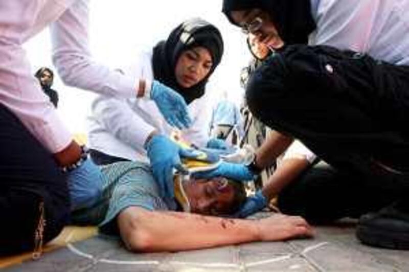 

DUBAI, UNITED ARAB EMIRATES, Mar 15 : Students of Paramedics, Medical and Applied Communications from Dubai WomenÕs College during the sixth mass casualty incident simulation at the College campus in Dubai . (Pawan Singh / The National) For News. Story by Kareem