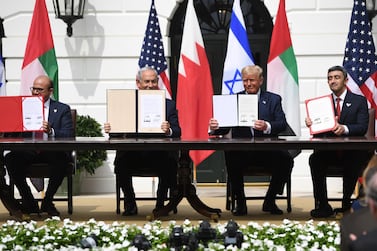 (L-R)Bahrain Foreign Minister Abdullatif al-Zayani, Israeli Prime Minister Benjamin Netanyahu, US President Donald Trump, and UAE Foreign Minister Abdullah bin Zayed Al-Nahyan hold up documents as they participated in the signing of the Abraham Accords where the countries of Bahrain and the United Arab Emirates recognize Israel, at the White House in Washington, DC, September 15, 2020. Israeli Prime Minister Benjamin Netanyahu and the foreign ministers of Bahrain and the United Arab Emirates arrived September 15, 2020 at the White House to sign historic accords normalizing ties between the Jewish and Arab states. / AFP / SAUL LOEB