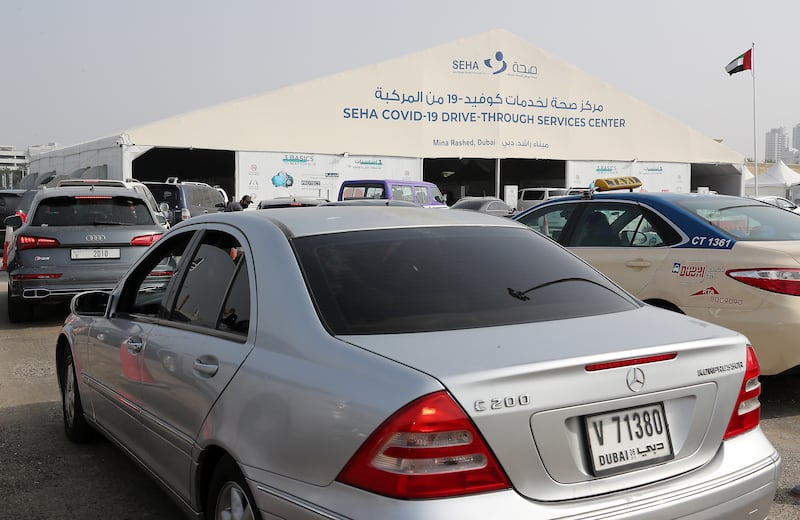 Queues at the Seha Covid-19 drive-through testing centre at Mina Rashed in Dubai. Pawan Singh / The National