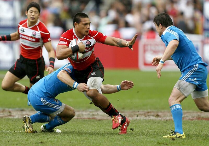 Japan, in red, pictured at the Hong Kong Sevens tournament on March 30, 2014, are so far ahead of their Asian counterparts it makes sense to reconsider the structure of the Asian Five Nations. Bobby Yip / Reuters