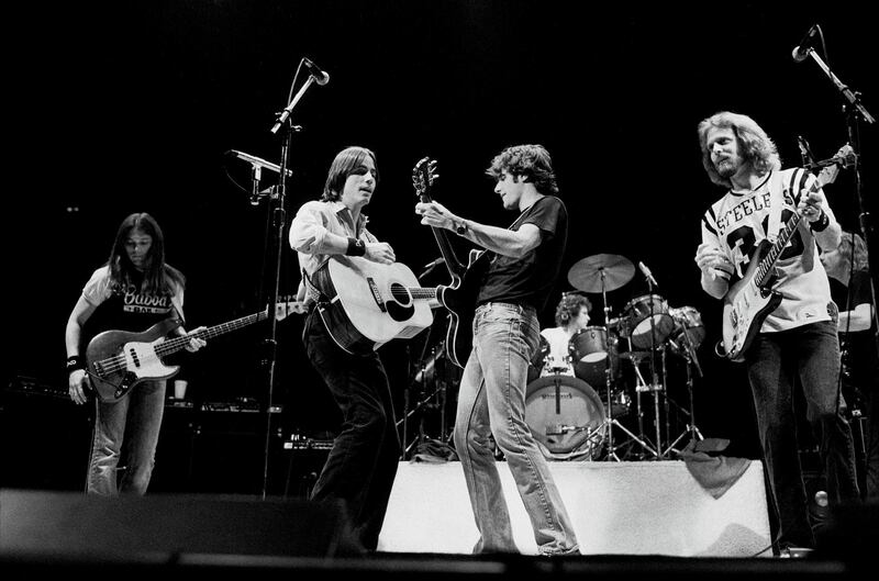 American rock group the Eagles, with special guest Jackson Browne (second left), perform onstage at the Chicago Stadium, Chicago, Illinois, October 22, 1979. Pictured are, from left, Timothy B Schmit, Jackson Browne, Glenn Frey, Don Henley (behind drums), Don Felder, and Joe Walsh. (Photo by Paul Natkin/Getty Images) *** Local Caption *** Timothy B Schmit;Jackson Browne;Glenn Frey;Don Henley;Joe Walsh;Don Felder