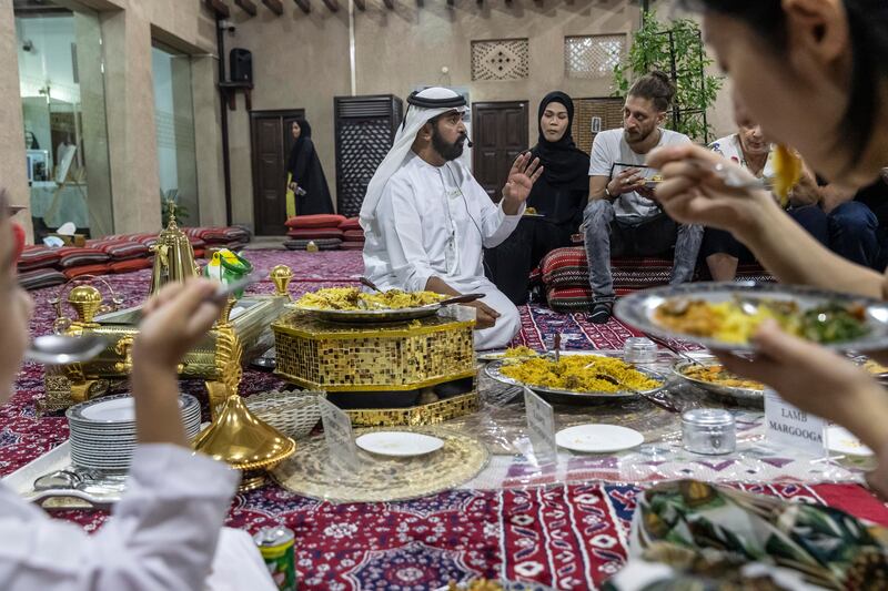 Visitors join a traditional Emirati iftar in one of the wind-tower houses in the heart of Dubai's Al Fahidi neighbourhood, where cultural speakers discuss Emirati culture and Ramadan.