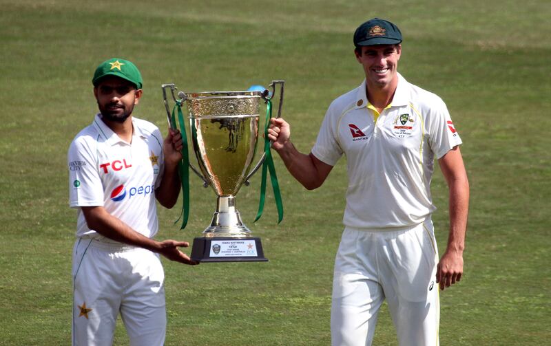 Pakistan's captain Babar Azam (L) and his Australian counterpart Pat Cummins (R) pose with the Test Series trophy prior to a practice session at the Rawalpindi Cricket Stadium in Rawalpindi, Pakistan, 02 March 2022.  Pakistan and Australia cricket teams will play their first Test match on 04 March 2022.   EPA / SOHAIL SHAHZAD