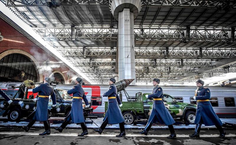 Russian honour guard soldiers march next to the train with "Syrian Breakthrough" exhibition pieces displayed. AFP