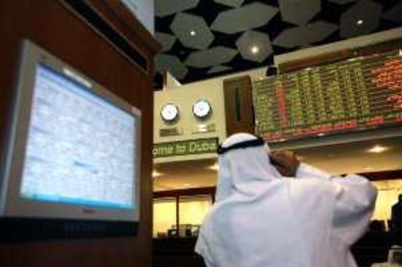 Dubai, UAE - June 17, 2009 - Traders on the floor of the Dubai Financial Market stock exchange. (Nicole Hill / The National) *** Local Caption ***  NH Stock05.jpgNH Stock05_2.jpgNH Stock05_2.jpg