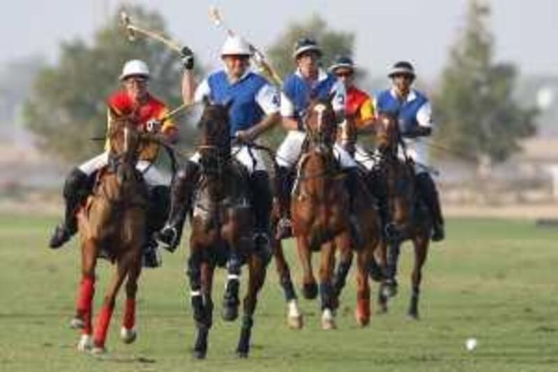 ABU DHABI.-FEB 21: Fernando Quinto(no4) leads the chase for the  Emirates (in blue) versus Habtoor in The Presidents Polo Cup  at the Ghantoot polo club on Weds 20th Feb.(Photo by Stephen Lock /ADMC)
